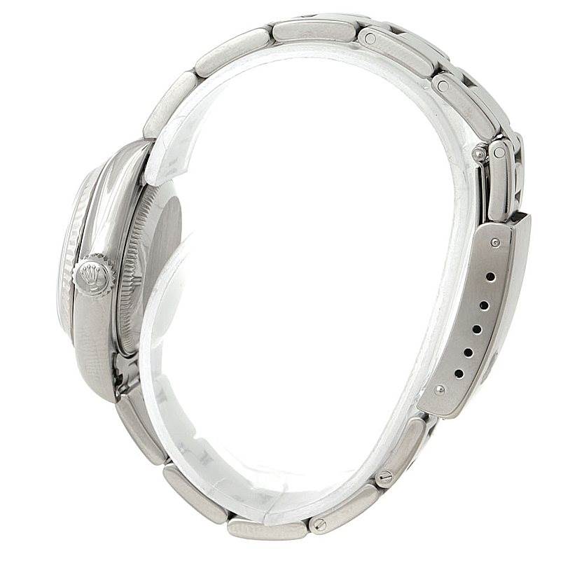 The image shows a side view of the Rolex Datejust 79174 Women's Stainless Steel Mother of Pearl Dial 79174 Women's Stainless Steel Mother of Pearl Dial watch, highlighting the crown and the bracelet.