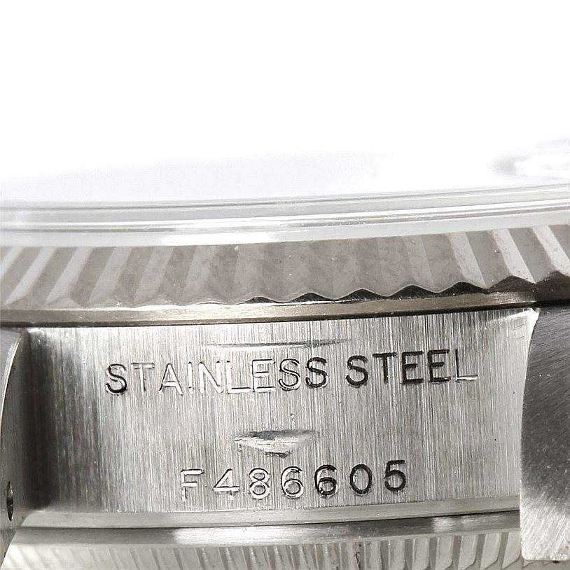 The image shows a close-up of the serial number and "Stainless Steel" engraving on the case side of a Rolex Datejust 79174 Women's Stainless Steel Mother of Pearl Dial 79174 Women's Stainless Steel Mother of Pearl Dial watch.
