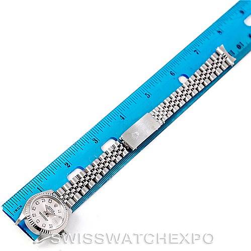 The image shows a Rolex Datejust 79174 Women's Stainless Steel Silver Dial 79174 Women's Stainless Steel Silver Dial watch laid flat next to a blue ruler, highlighting the watch case and jubilee bracelet.