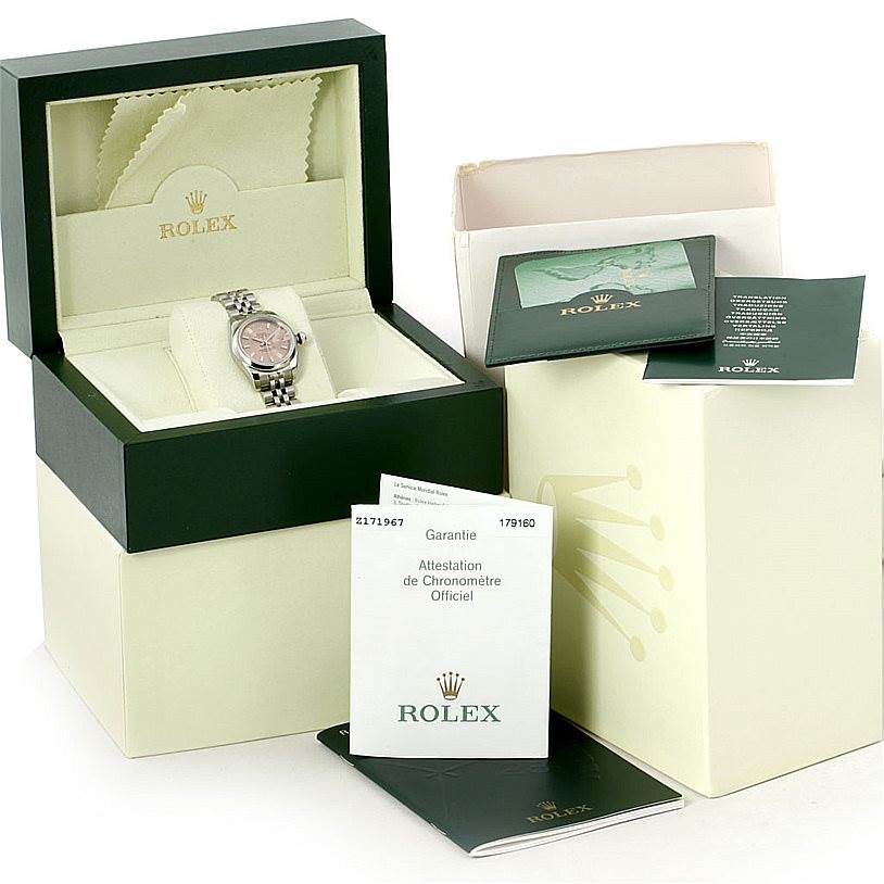 The image shows a Rolex Datejust 179160 Women's Stainless Steel Pink Dial 179160 Women's Stainless Steel Pink Dial watch with packaging, including the inner box, outer box, warranty booklet, and cleaning cloth.