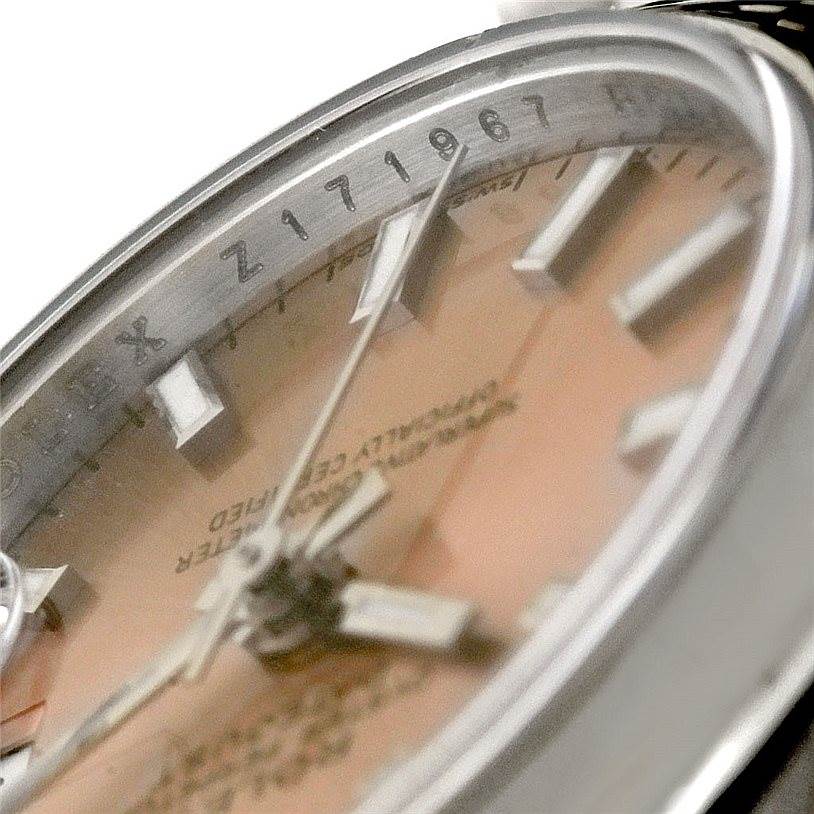 This close-up image shows a side angle view of the dial and bezel of the Rolex Datejust 179160 Women's Stainless Steel Pink Dial 179160 Women's Stainless Steel Pink Dial watch.
