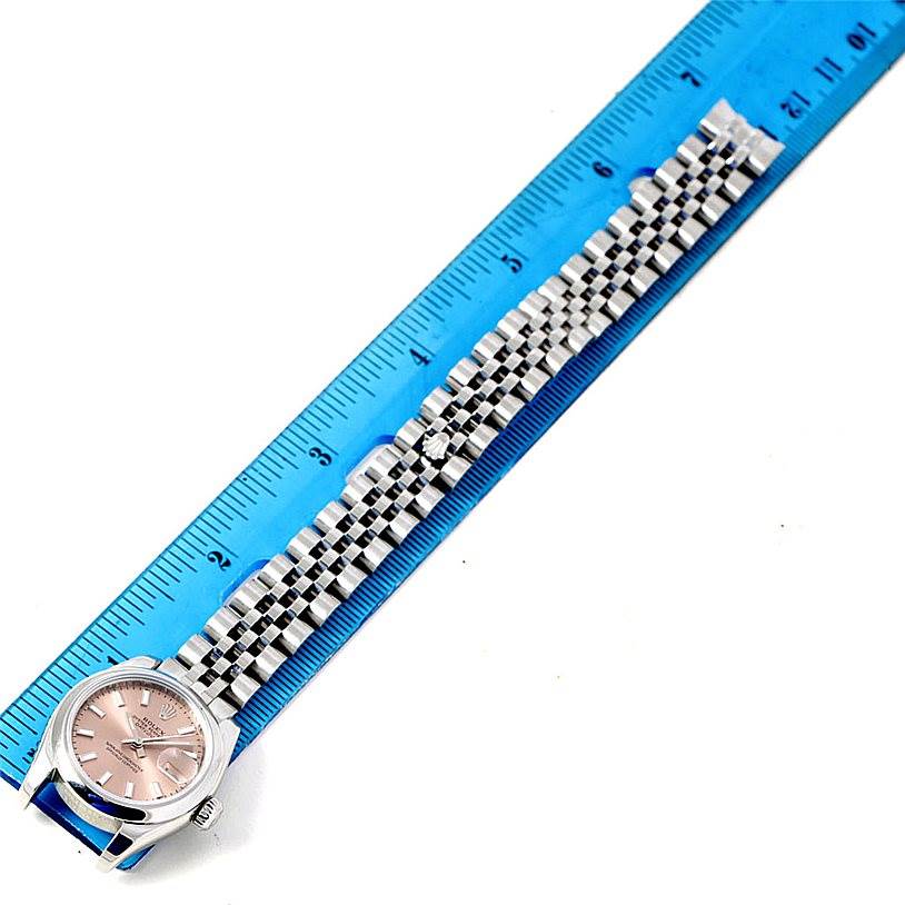 The image shows a Rolex Datejust 179160 Women's Stainless Steel Pink Dial 179160 Women's Stainless Steel Pink Dial watch lying flat with a ruler for scale, displaying the watch face and metal bracelet.