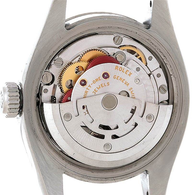 This image shows the inner mechanical movement of the Rolex Datejust 179174 Women's Stainless Steel Silver Dial 179174 Women's Stainless Steel Silver Dial model at a top-down angle with visible gears and rotor.