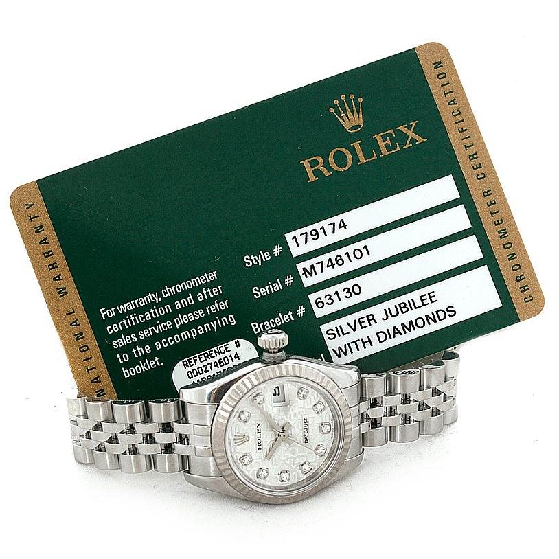 The image shows a Rolex Datejust 179174 Women's Stainless Steel Silver Dial 179174 Women's Stainless Steel Silver Dial watch with a fluted bezel and silver jubilee bracelet, accompanied by its certification card.