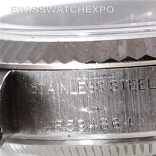 This close-up shows the side view of a Rolex Datejust 79174 Women's Stainless Steel White Dial 79174 Women's Stainless Steel White Dial watch, focusing on the stainless steel casing with model number engraving.