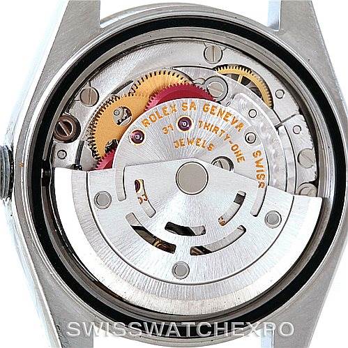 The image shows the movement mechanism of a Rolex Datejust 79174 Women's Stainless Steel White Dial 79174 Women's Stainless Steel White Dial watch from the back, highlighting gears and components.