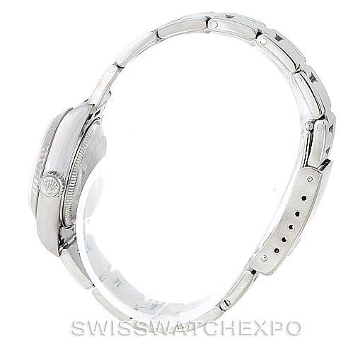 The image shows a side view of a Rolex Datejust 79174 Women's Stainless Steel White Dial 79174 Women's Stainless Steel White Dial watch, highlighting the crown, case, and part of the bracelet.