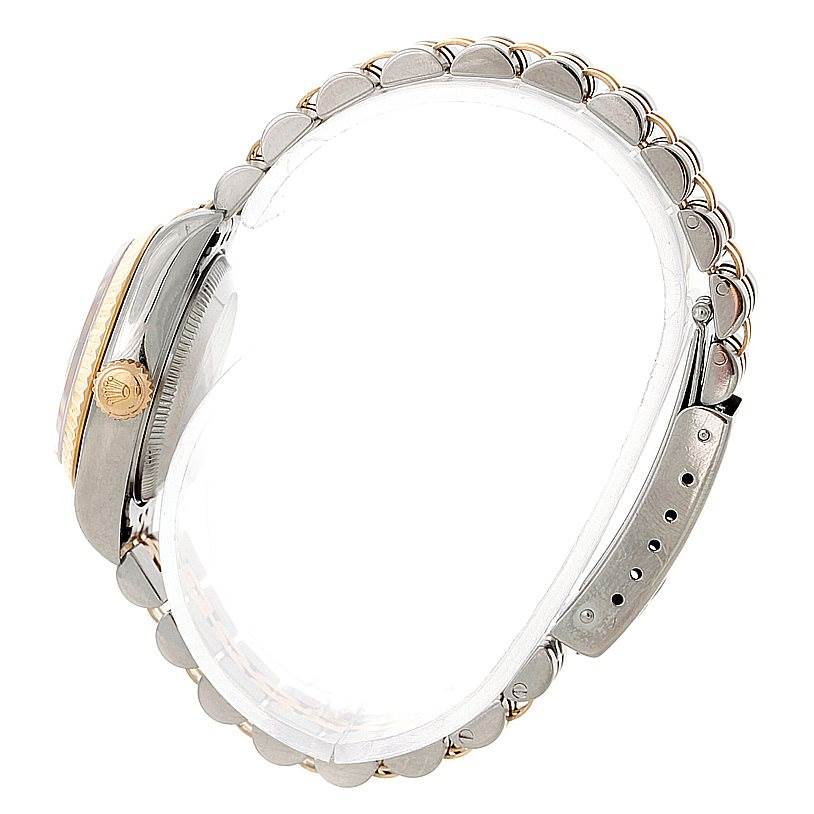 This side view of the Rolex Datejust 79173 Women's Stainless Steel Blue Dial 79173 Women's Stainless Steel Blue Dial watch showcases its case, crown, and bracelet.