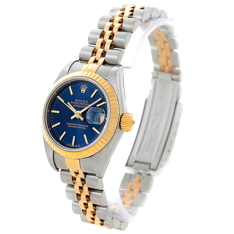 This image shows an oblique view of the Rolex Datejust 79173 Women's Stainless Steel Blue Dial 79173 Women's Stainless Steel Blue Dial watch, highlighting its blue dial, fluted bezel, and Jubilee bracelet.