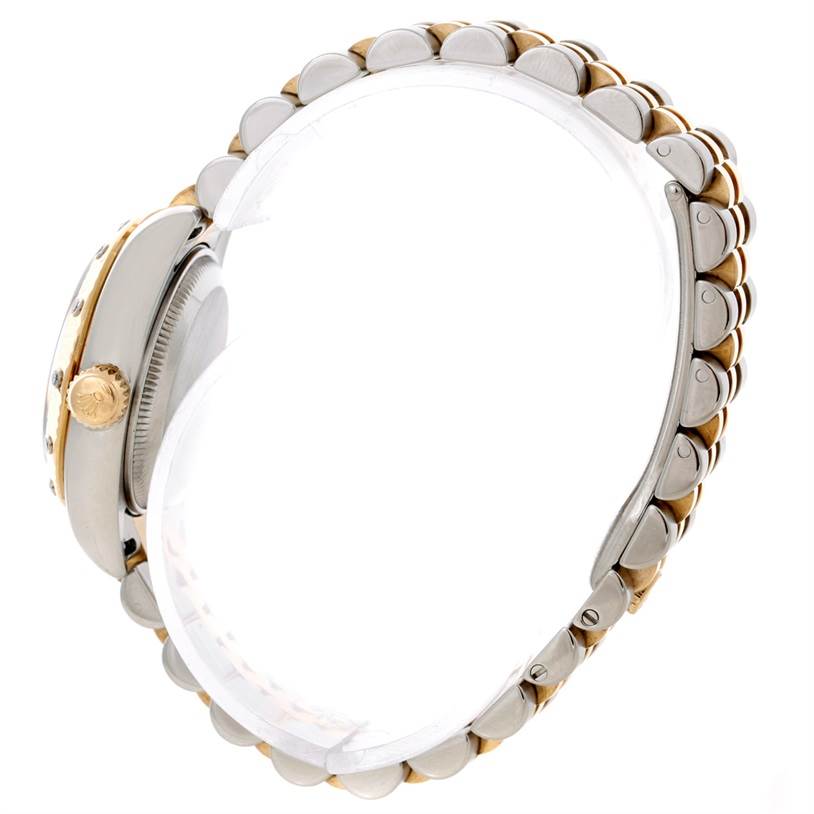 The image shows a Rolex Datejust 179313 Women
s Stainless Steel Beige Dial 179313 Women
s Stainless Steel Beige Dial watch viewed from the side, showcasing the crown and part of the bracelet.