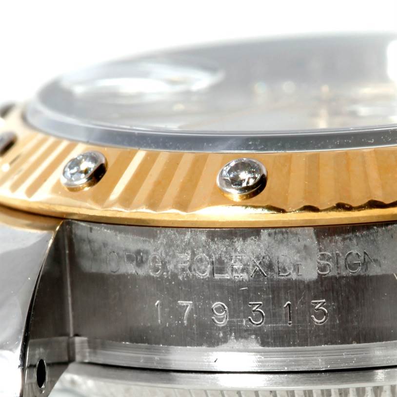 This image shows a close-up of the bezel and part of the case, featuring the model number and engravings of the Rolex Datejust 179313 Women
s Stainless Steel Beige Dial 179313 Women
s Stainless Steel Beige Dial watch.