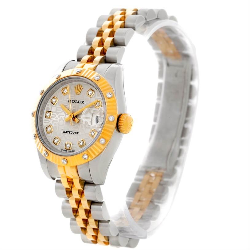 The Rolex Datejust 179313 Women
s Stainless Steel Beige Dial 179313 Women
s Stainless Steel Beige Dial watch is shown at an oblique angle, highlighting its two-tone bracelet, diamond markers, and fluted bezel.