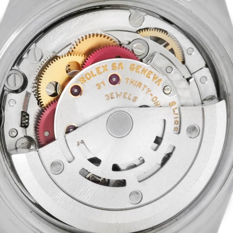 This image shows the intricate internal mechanism of a Rolex Datejust 79160 Women's Stainless Steel White Dial 79160 Women's Stainless Steel White Dial watch from a close-up, back view angle.