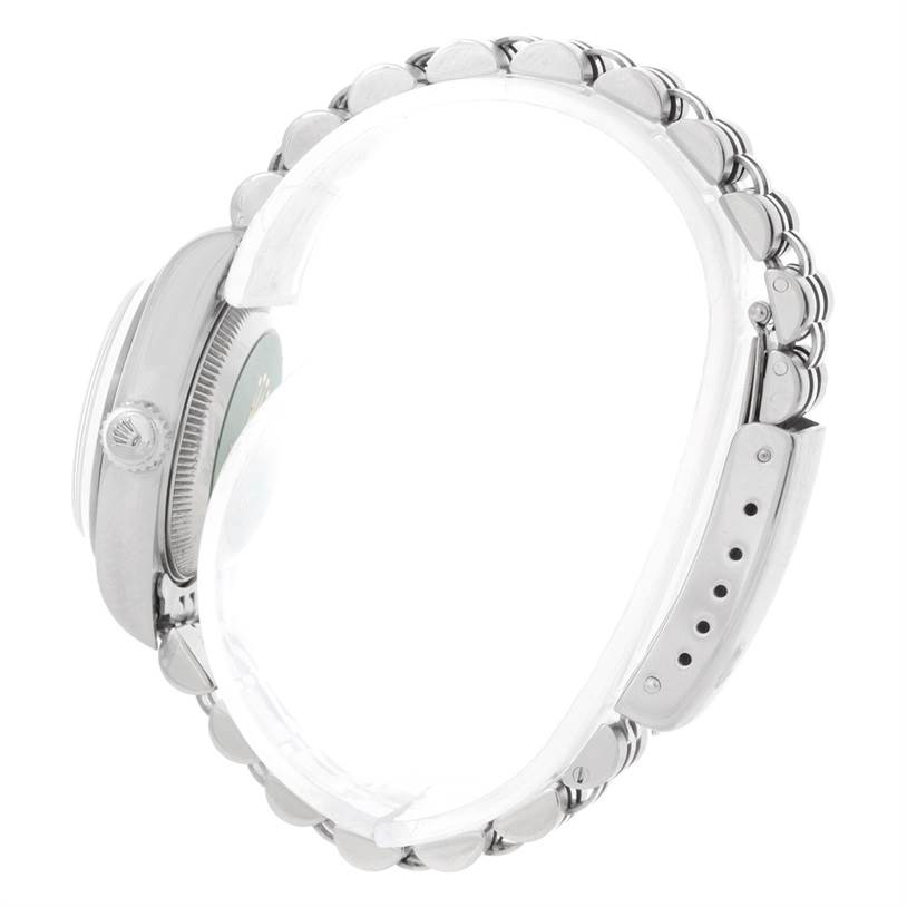 The image shows the side profile of a Rolex Datejust 79160 Women's Stainless Steel White Dial 79160 Women's Stainless Steel White Dial watch, highlighting its bezel, crown, and bracelet.