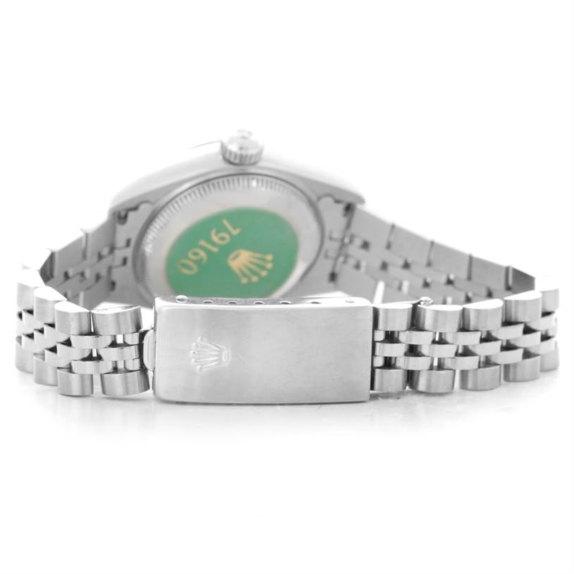 The image shows the back of a Rolex Datejust 79160 Women's Stainless Steel White Dial 79160 Women's Stainless Steel White Dial watch and its clasp in a partially open position.