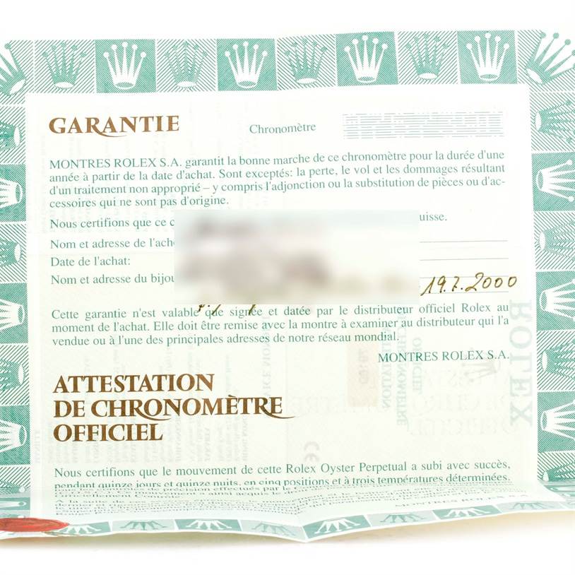 The image shows a warranty card for a Rolex Datejust 79160 Women's Stainless Steel White Dial 79160 Women's Stainless Steel White Dial watch at a top-down angle.