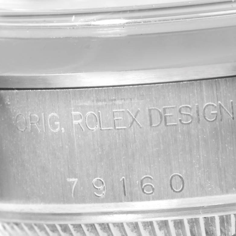 The image shows a close-up of the case side of a Rolex Datejust 79160 Women's Stainless Steel White Dial 79160 Women's Stainless Steel White Dial, focusing on its engraved serial and model numbers.