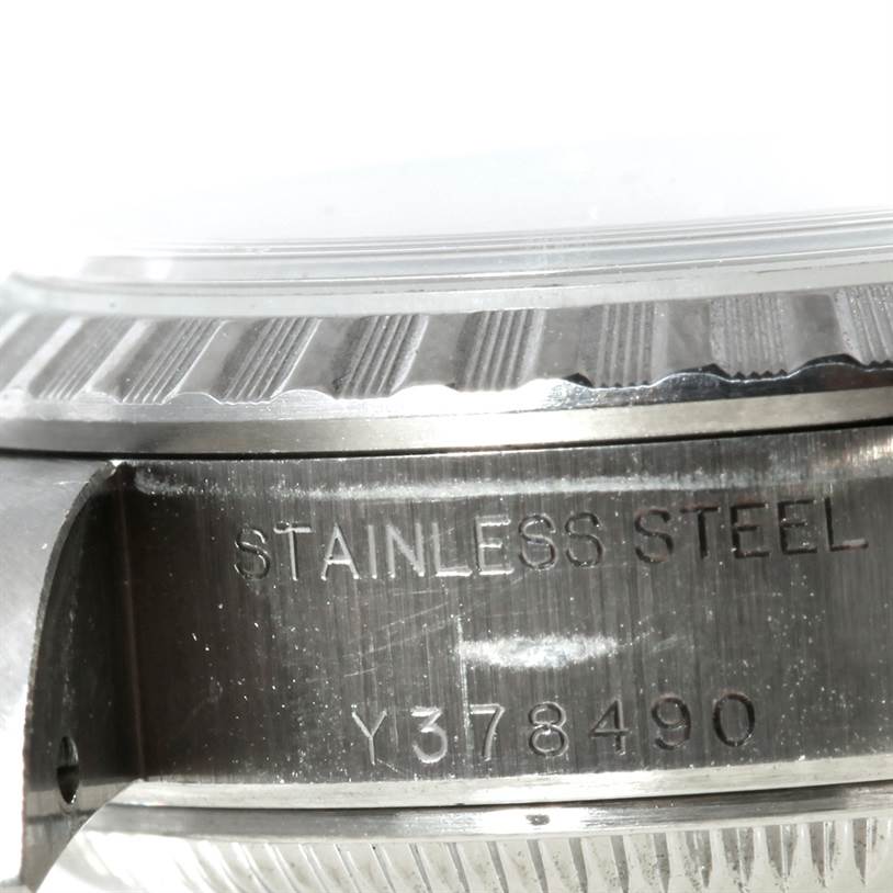 This image shows a close-up of the side of a Rolex Datejust 79160 Women's Stainless Steel Silver Dial 79160 Women's Stainless Steel Silver Dial watch with the stainless steel case and serial number visible.