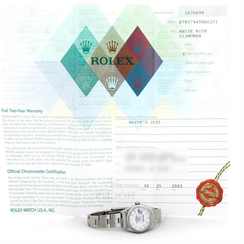 The image shows a Rolex Datejust 79174 Women's Stainless Steel White Dial 79174 Women's Stainless Steel White Dial watch placed in front of its warranty and certification documents.