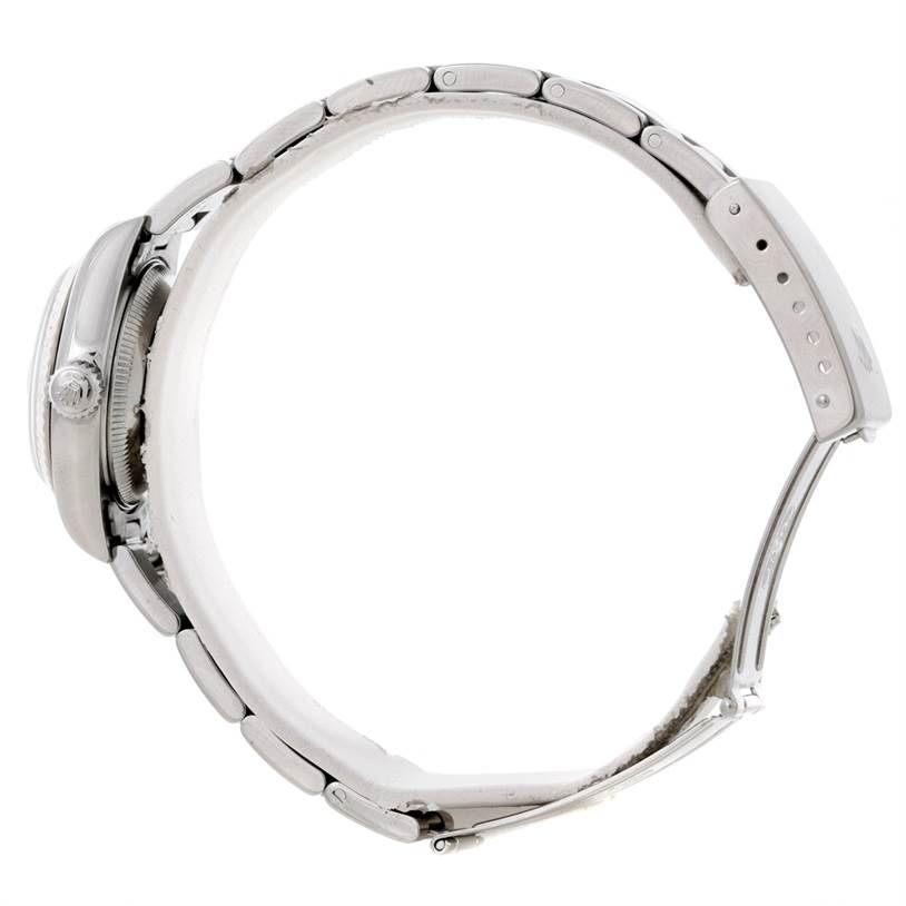 This image shows a side profile of the Rolex Datejust 79174 Women's Stainless Steel White Dial 79174 Women's Stainless Steel White Dial watch, focusing on the bracelet, crown, and part of the case.