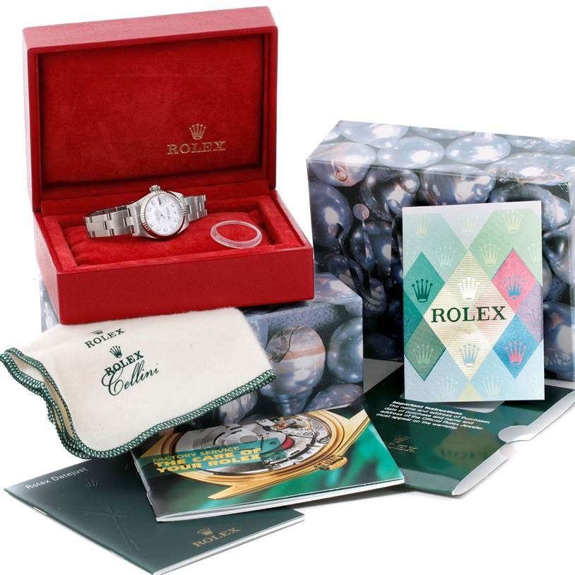 The Rolex Datejust 79174 Women's Stainless Steel White Dial 79174 Women's Stainless Steel White Dial watch is displayed in its open box with accompanying booklets, a cleaning cloth, and outer packaging.