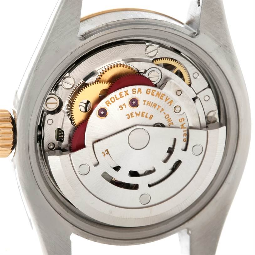 This image shows the internal mechanics and movement of a Rolex Datejust 179163 Women's Steel and Gold (two tone) White Dial 179163 Women's Steel and Gold (two tone) White Dial watch, providing a view of its intricate components.