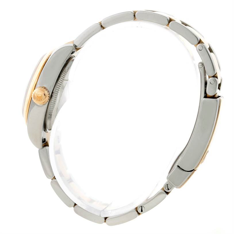 The image shows a Rolex Datejust 179163 Women's Steel and Gold (two tone) White Dial 179163 Women's Steel and Gold (two tone) White Dial watch from the side, highlighting its crown and bracelet.