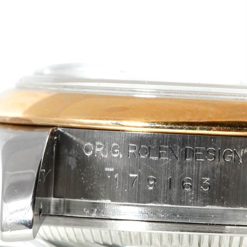 The image shows a side view of the Rolex Datejust 179163 Women's Steel and Gold (two tone) White Dial 179163 Women's Steel and Gold (two tone) White Dial watch case with the model number and engraving "ORIG. ROLEX DESIGN."