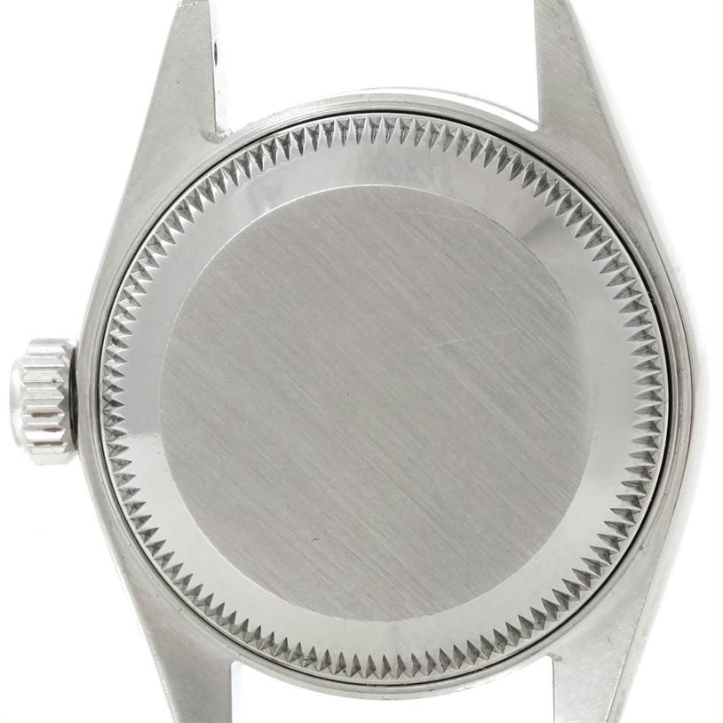 The image shows the case back and part of the crown of a Rolex Datejust 79160 Women's Stainless Steel White Dial 79160 Women's Stainless Steel White Dial watch.