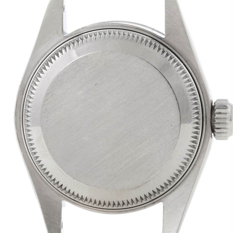 The image shows the back case and crown of a Rolex Datejust 69160 Women
s Stainless Steel Blue Dial 69160 Women
s Stainless Steel Blue Dial watch from a straight-on angle.