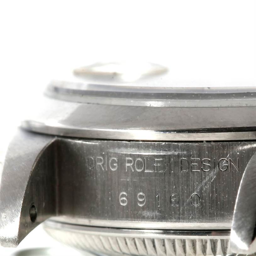 This close-up image shows the case side of a Rolex Datejust 69160 Women
s Stainless Steel Blue Dial 69160 Women
s Stainless Steel Blue Dial, highlighting its engraved model number and part of the lug.