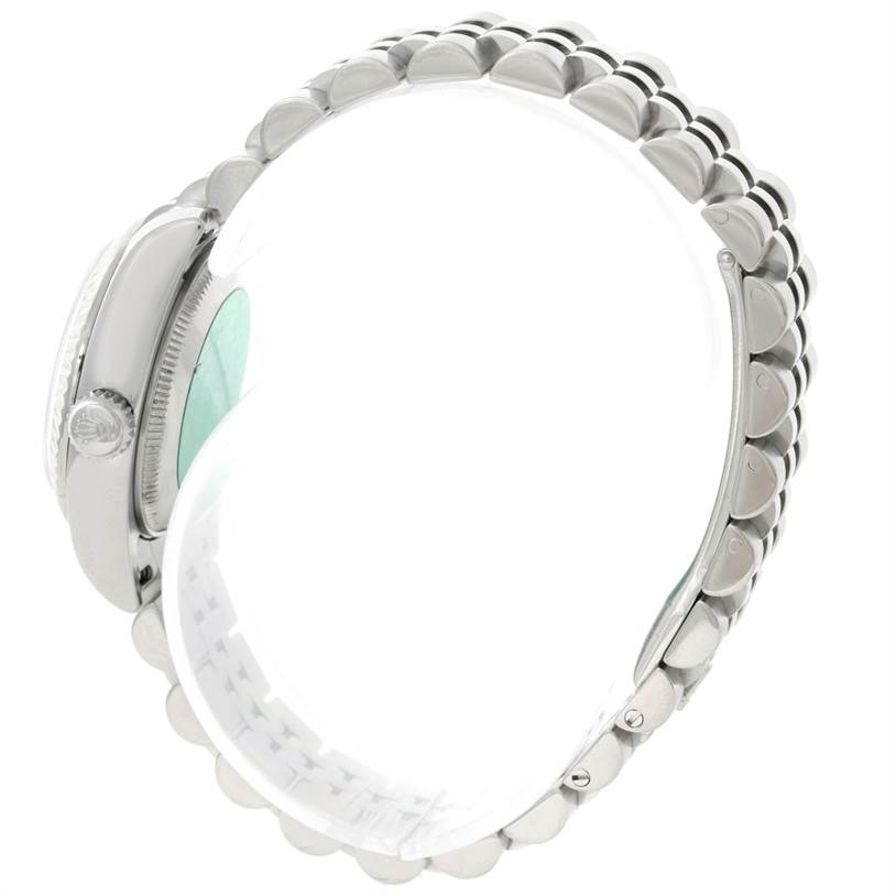 The Rolex Datejust 179174 Women's Stainless Steel Mother of Pearl Dial 179174 Women's Stainless Steel Mother of Pearl Dial watch is shown from a side angle, highlighting the crown and partial view of the bracelet.