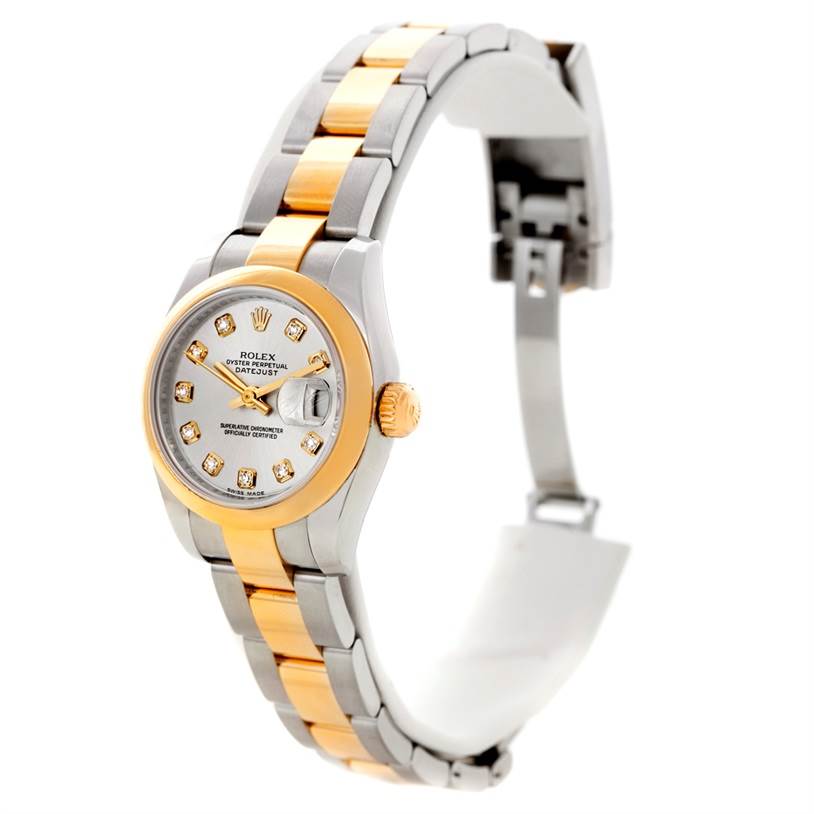 The Rolex Datejust 179163 Women's Steel and Gold (two tone) Silver Dial 179163 Women's Steel and Gold (two tone) Silver Dial watch is shown at a side angle, displaying the band, face, bezel, dial, and partially open clasp.
