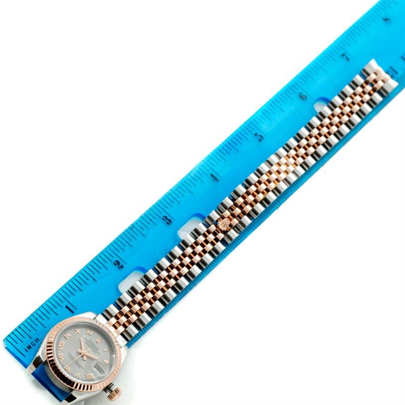 The Rolex Datejust 179171 Women's Steel and Gold (two tone) Grey Dial 179171 Women's Steel and Gold (two tone) Grey Dial watch is shown from the top, displaying the face, bezel, and entire bracelet alongside a ruler for scale.