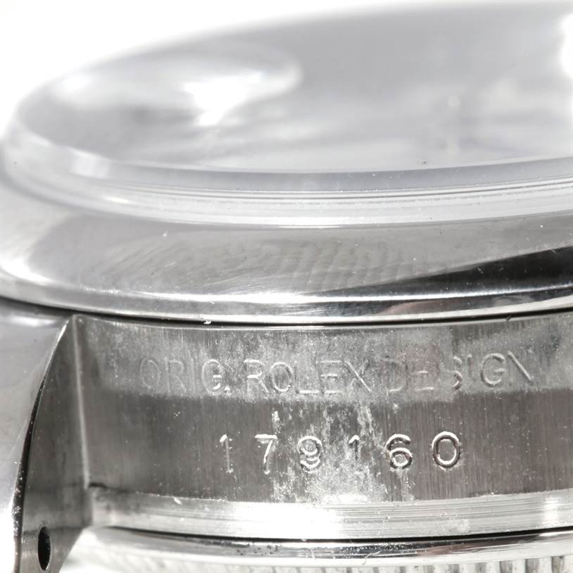 The image shows a close-up of the case side and part of the bezel and crystal of a Rolex Datejust 179160 Women's Stainless Steel White Dial 179160 Women's Stainless Steel White Dial watch, displaying the model number and engraving.