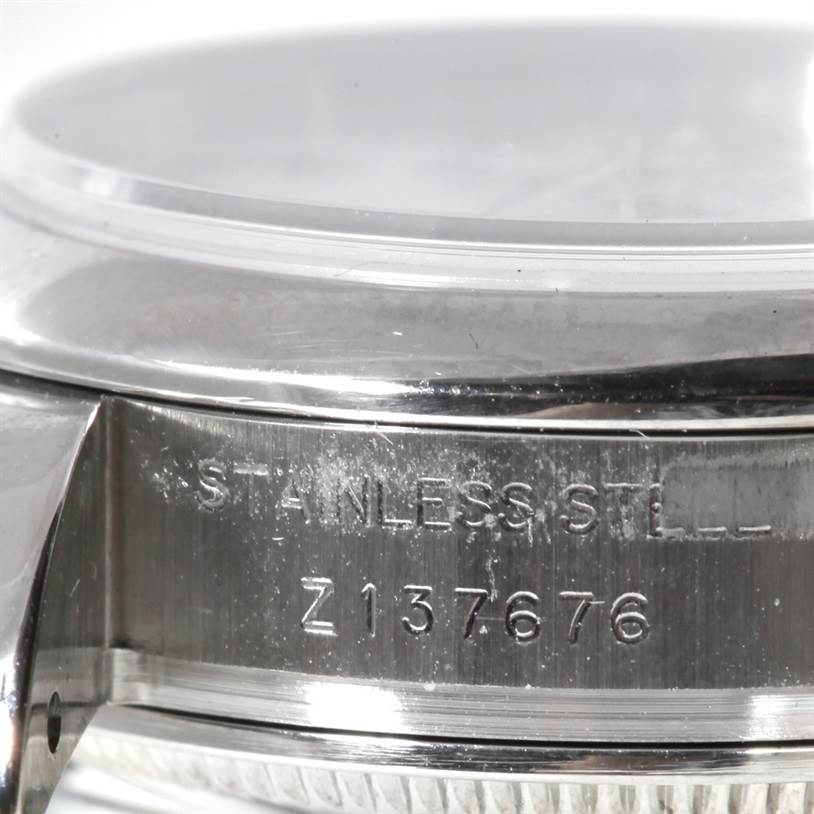 This image shows a close-up of the side engraving on a stainless steel Rolex Datejust 179160 Women's Stainless Steel White Dial 179160 Women's Stainless Steel White Dial watch case with the serial number visible.