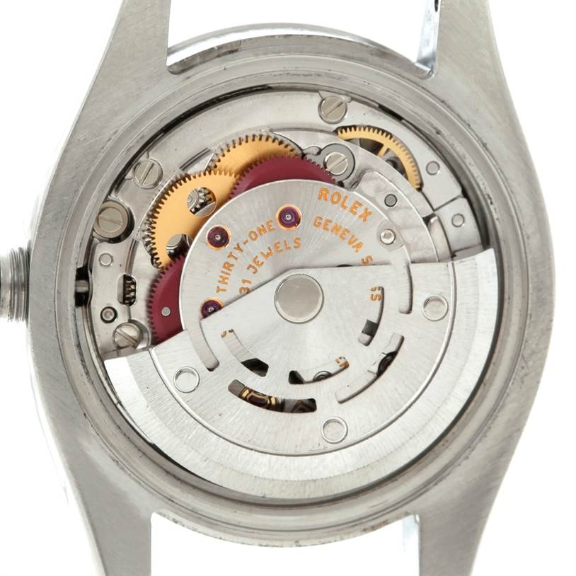 The image shows the internal mechanism of a Rolex Datejust 179160 Women's Stainless Steel White Dial 179160 Women's Stainless Steel White Dial watch, focusing on its movement and gears from the back.