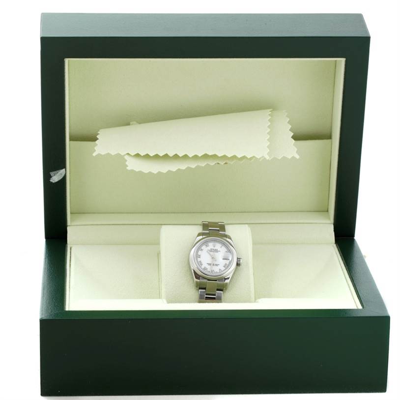 This image shows a Rolex Datejust 179160 Women's Stainless Steel White Dial 179160 Women's Stainless Steel White Dial watch displayed in its open green case with a polishing cloth on the inside.
