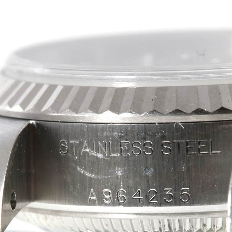 The image shows a close-up side view of the casing and serial number of a Rolex Datejust 79174 Women's Stainless Steel Silver Dial 79174 Women's Stainless Steel Silver Dial watch.