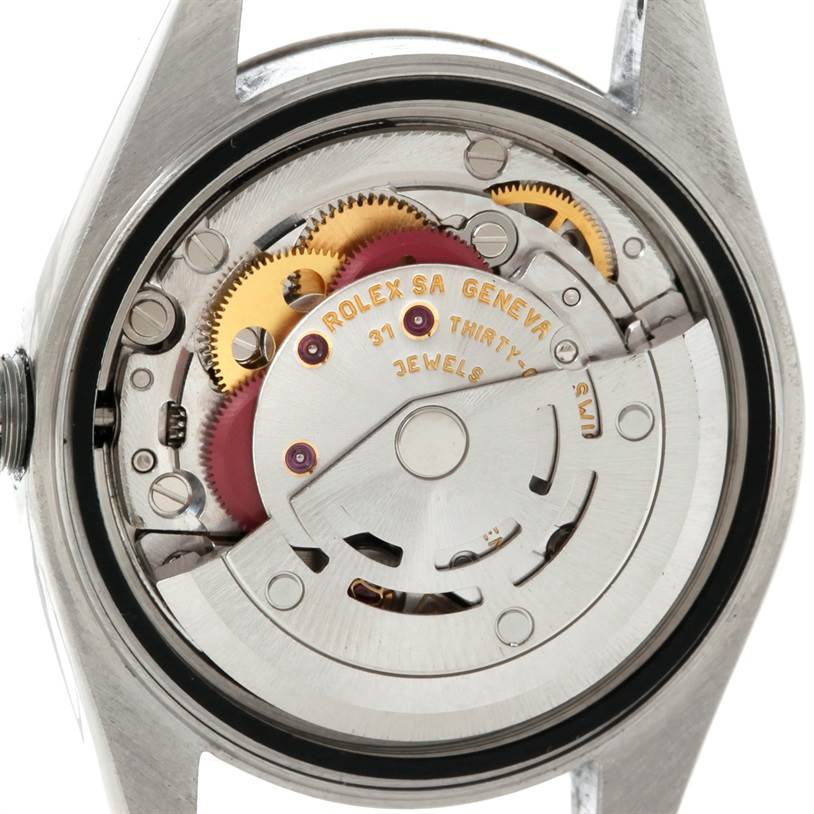 The image shows the internal mechanism of a Rolex Datejust 79174 Women's Stainless Steel Mother of Pearl Dial 79174 Women's Stainless Steel Mother of Pearl Dial watch from the back, displaying gears and other components.