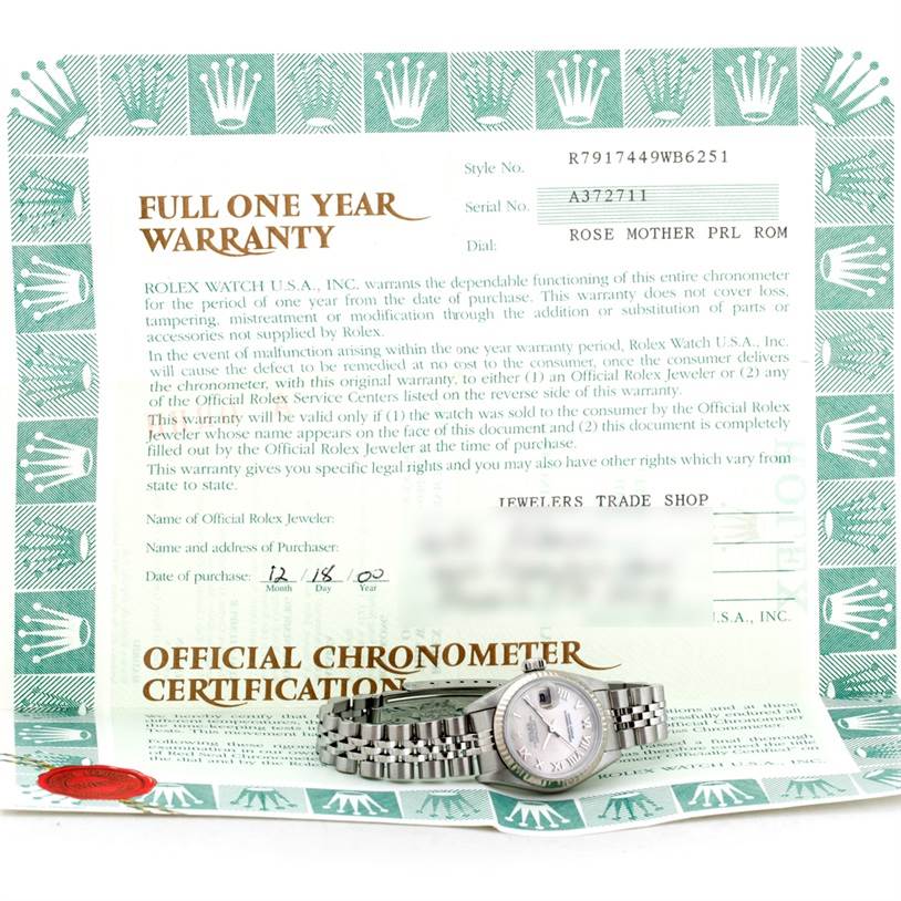 The image shows a Rolex Datejust 79174 Women's Stainless Steel Mother of Pearl Dial 79174 Women's Stainless Steel Mother of Pearl Dial watch placed on its warranty card and certificate, viewed from the front.