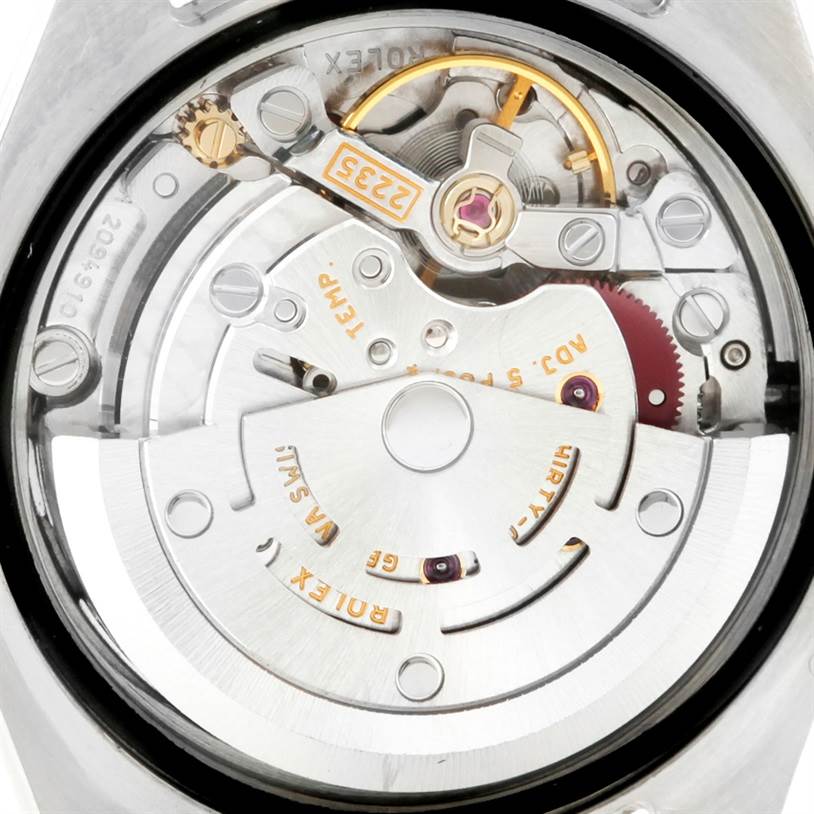 The image shows the internal movement of a Rolex Datejust 179173 Women
s Steel and Gold (two tone) White Dial 179173 Women
s Steel and Gold (two tone) White Dial watch, specifically focusing on the rotor and gears.