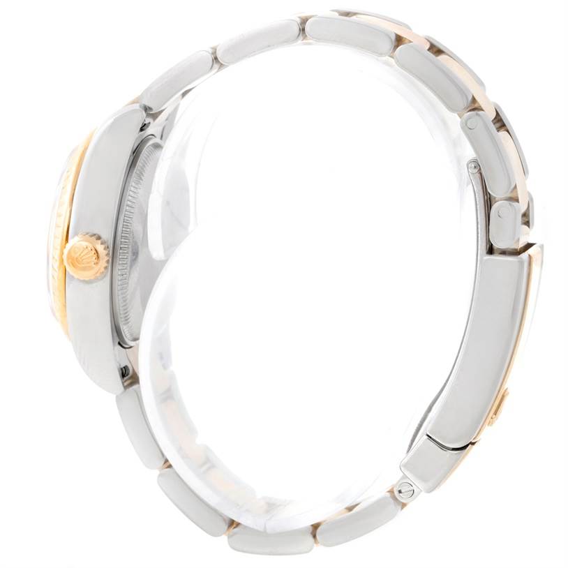 The image shows a side view of a Rolex Datejust 179173 Women
s Steel and Gold (two tone) White Dial 179173 Women
s Steel and Gold (two tone) White Dial watch, highlighting its crown, case, and bracelet.
