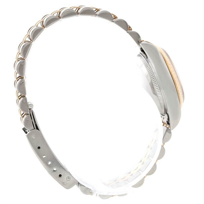 This image shows a side view of the Rolex Datejust 69173 Women
s Stainless Steel White Dial 69173 Women
s Stainless Steel White Dial watch, highlighting its two-tone band and case.