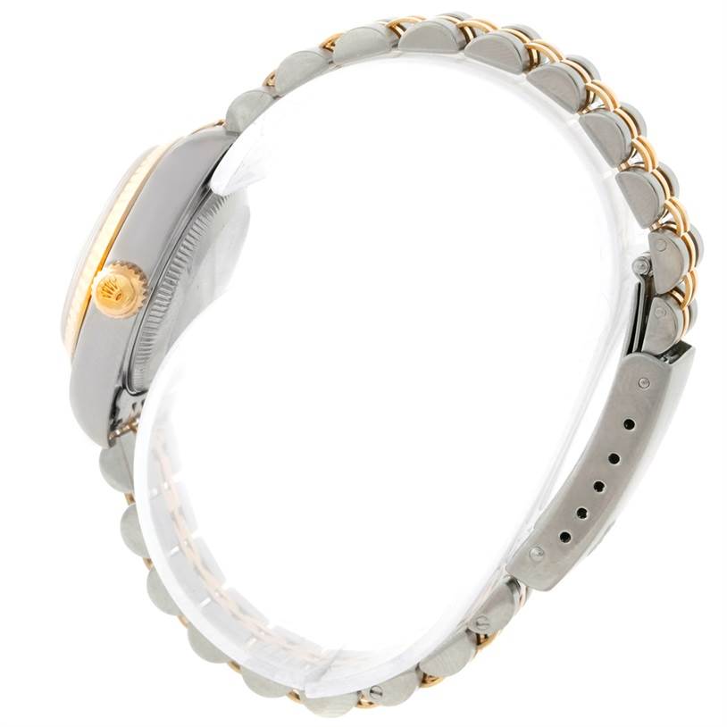 The image shows the side view of a Rolex Datejust 79173 Women's Stainless Steel Silver Dial 79173 Women's Stainless Steel Silver Dial watch highlighting its crown, case, and bracelet.