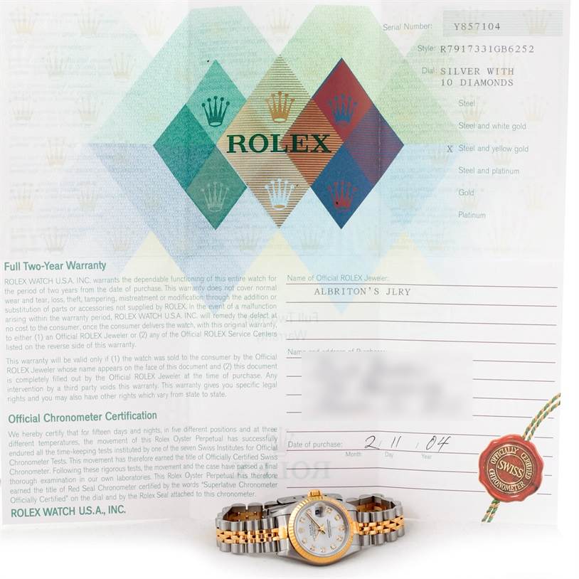 The image shows a Rolex Datejust 79173 Women's Stainless Steel Silver Dial 79173 Women's Stainless Steel Silver Dial watch and its warranty documentation, including a receipt and certificate.