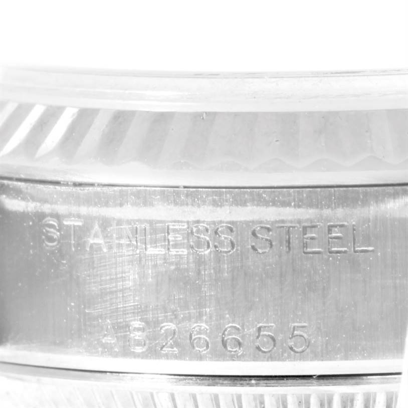 This close-up image shows the side of the stainless steel case of a Rolex Datejust 79174 Women
s Stainless Steel White Dial 79174 Women
s Stainless Steel White Dial watch, displaying the engraving.