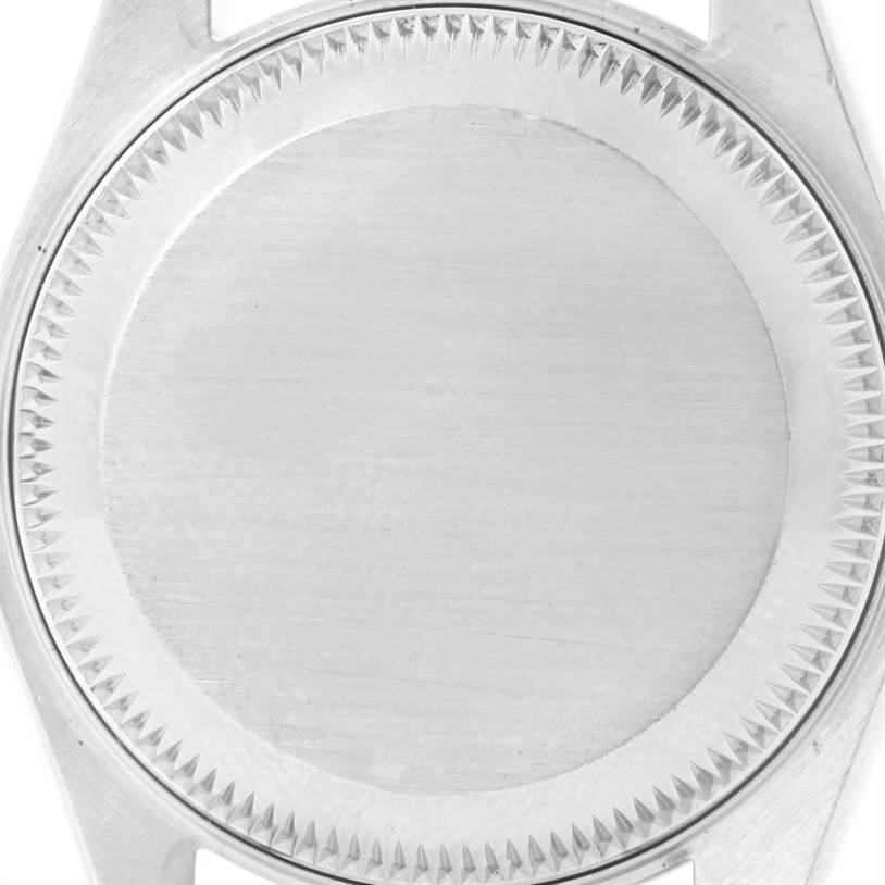 The image shows a close-up view of the caseback of a Rolex Datejust 79174 Women
s Stainless Steel White Dial 79174 Women
s Stainless Steel White Dial watch.