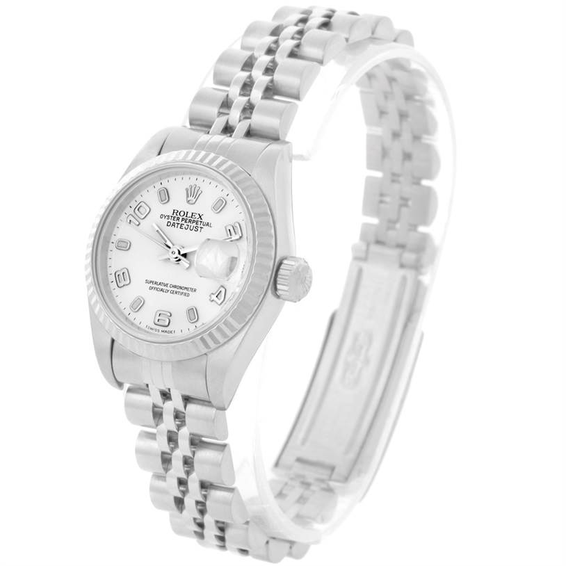 The image shows a Rolex Datejust 79174 Women
s Stainless Steel White Dial 79174 Women
s Stainless Steel White Dial watch at an angled view, displaying the dial, bezel, crown, and Jubilee bracelet.