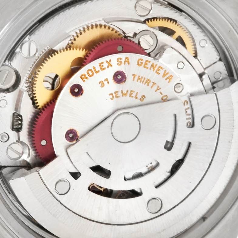 This image shows a close-up view of the internal movement mechanism of a Rolex Datejust 79174 Women
s Stainless Steel White Dial 79174 Women
s Stainless Steel White Dial watch, highlighting gears and jewels.